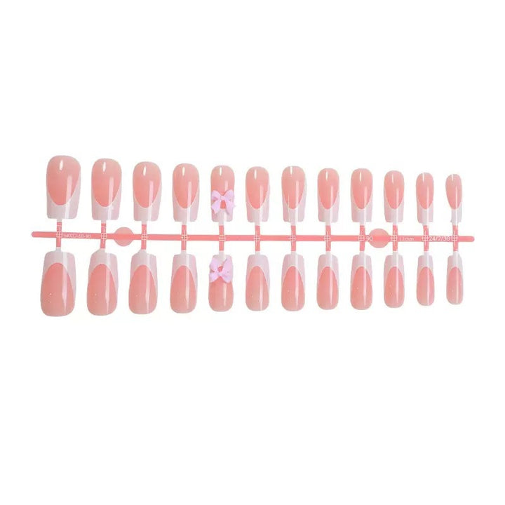 Nail set with playful bow design Stornfield