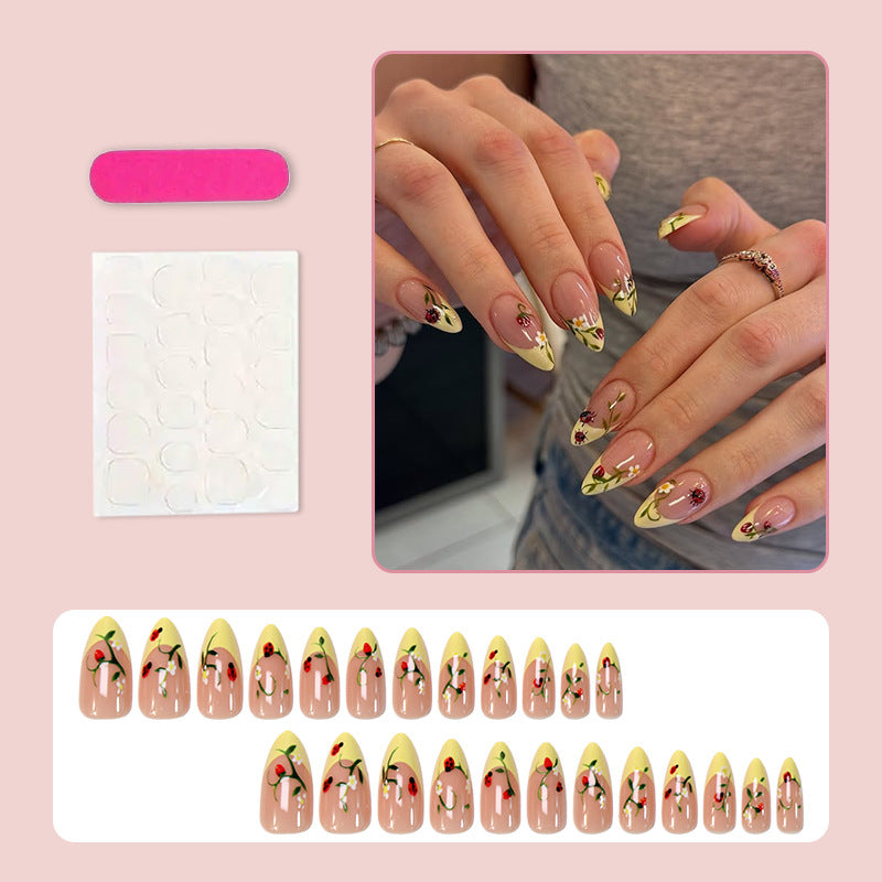 Artificial nail set with elegant gradient and floral accents Stornfield