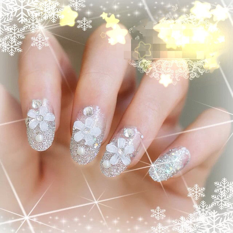 Artificials nails with sparkling rhinestone accents and elegant flower embellishments Stornfield