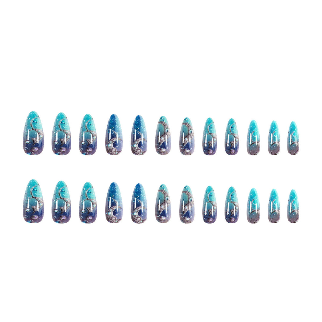 Artistic stiletto nails with glitter and marine motifs Stornfield