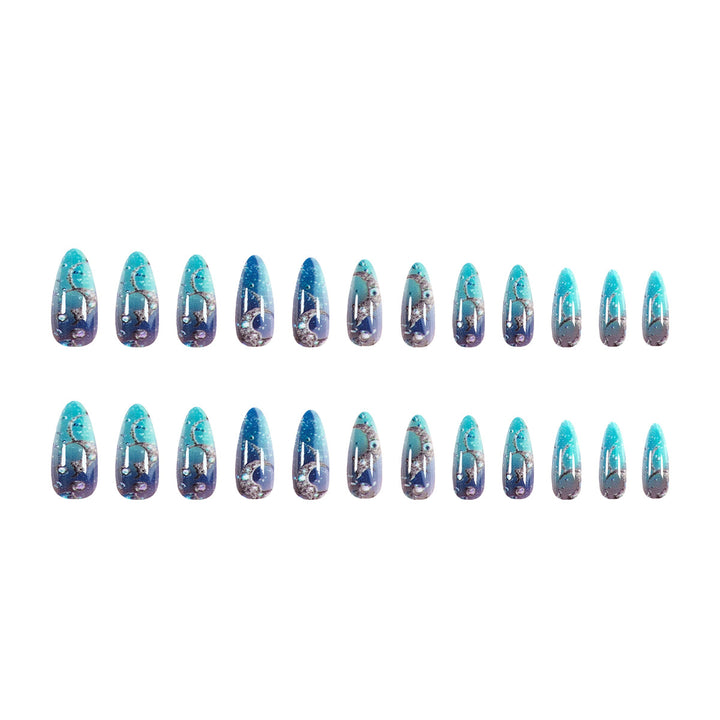 Artistic stiletto nails with glitter and marine motifs Stornfield