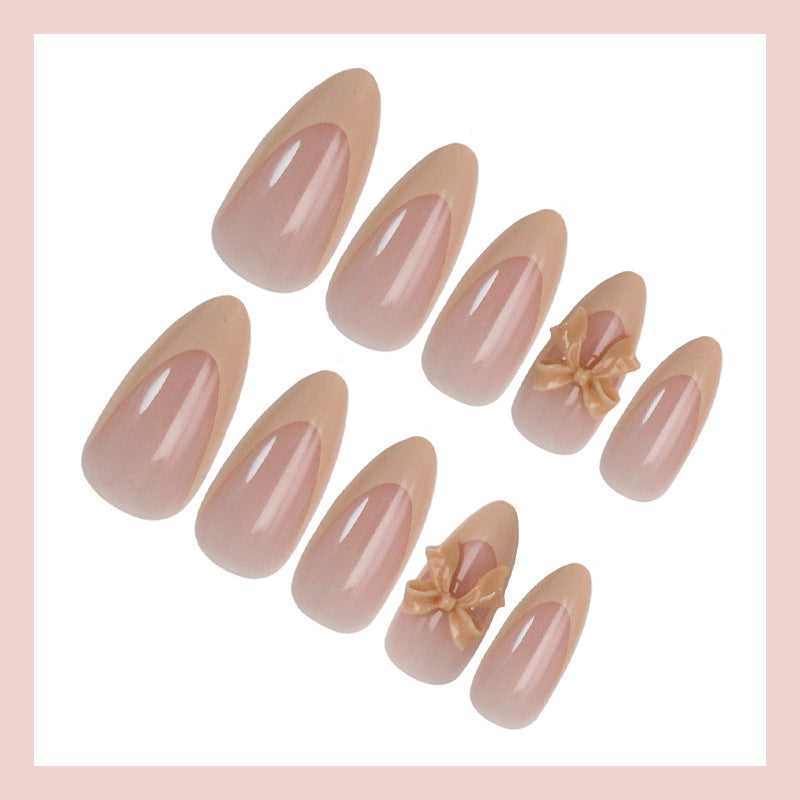 Artificial nail set with elegant tips and romantic bow decorations Stornfield