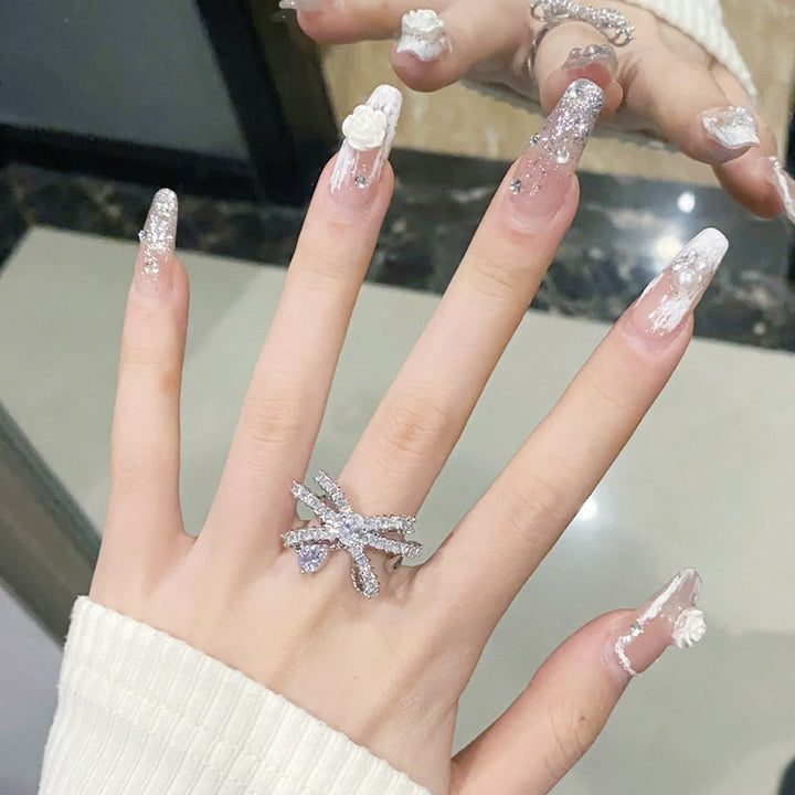 Acrylic nail set with elegant 3D flower and glitter decorations Stornfield