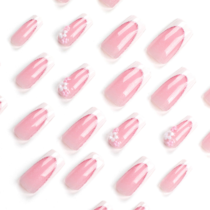 Artful Nail Extensions with Glitter and Flower Accents Stornfield