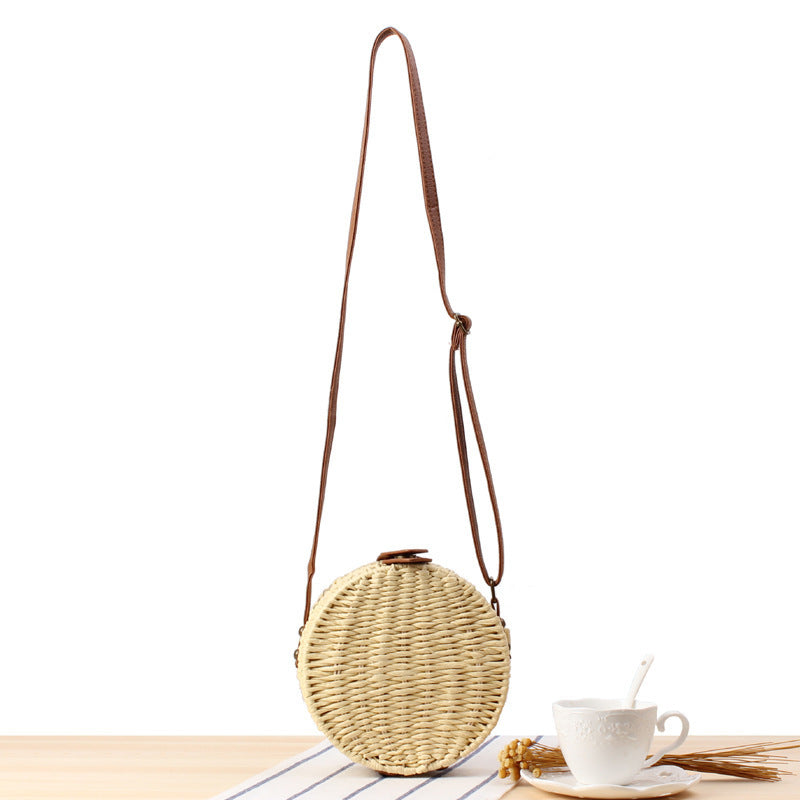 Round basket bag with leather accents Stornfield