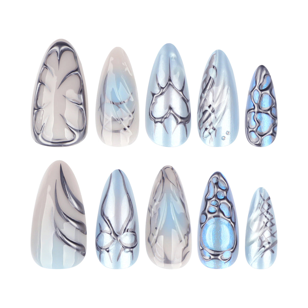 Artful stiletto nails with playful metallic details Stornfield