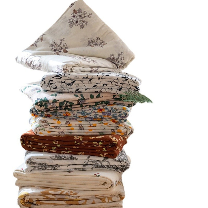 Organic Cotton Muslin Swaddle Blanket with Playful Cartoon Print