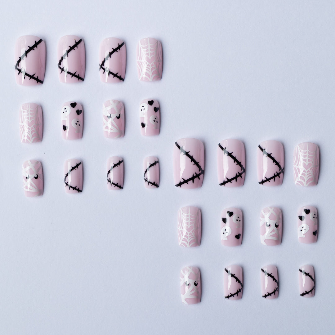 Halloween-Themed Ghost and Spider Nail Art