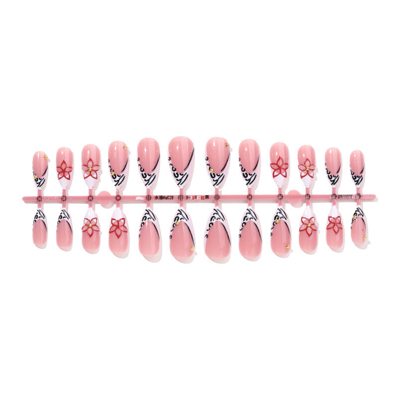 Artificial nail set with elegant ribbon and flower embellishments Stornfield