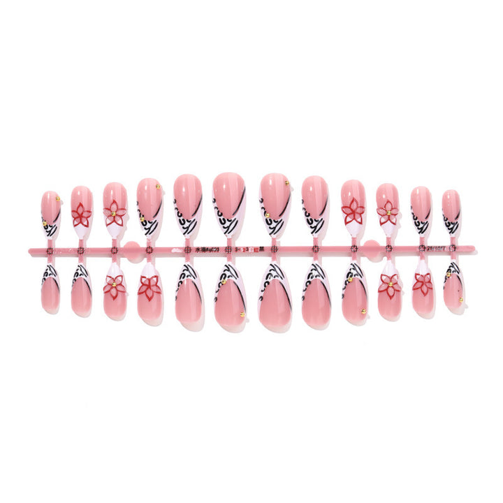 Artificial nail set with elegant ribbon and flower embellishments Stornfield
