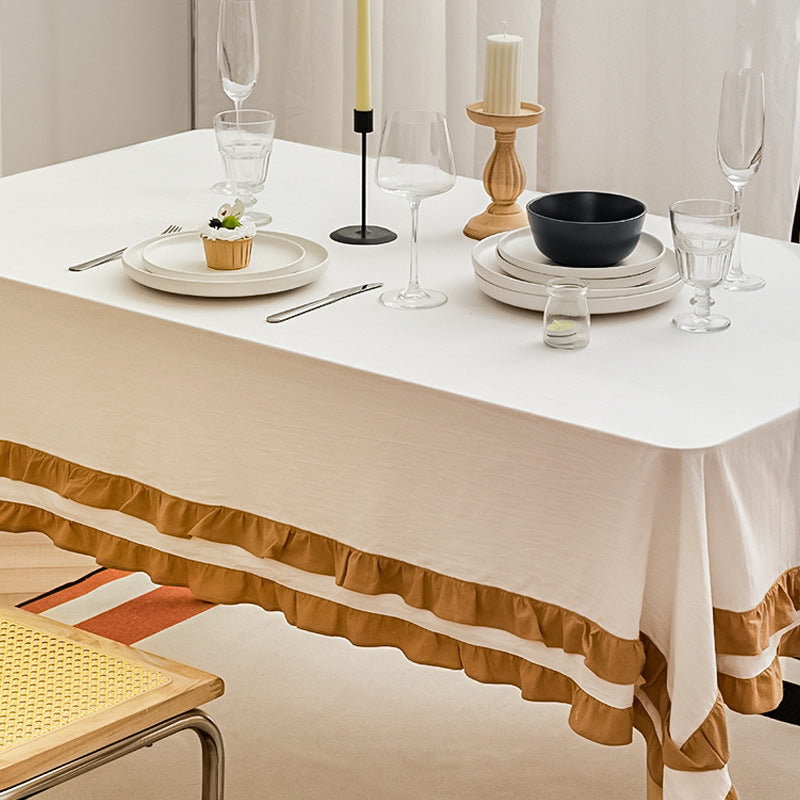 Round tablecloth with quilted textured relief and double-layered ruffle Stornfield
