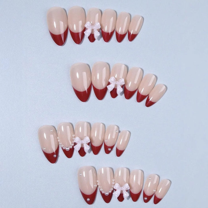 Artificial nail set with glamorous rhinestone and bow decorations Stornfield