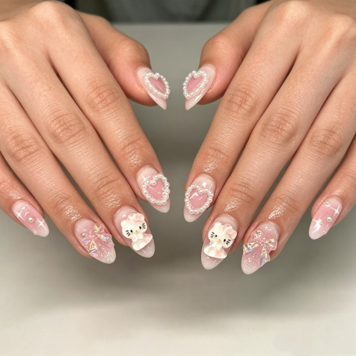 Playful artificial nails with heart and kitty motifs Stornfield