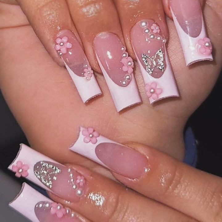 Artificial nail set with playful 3D flowers and glitter accents Stornfield