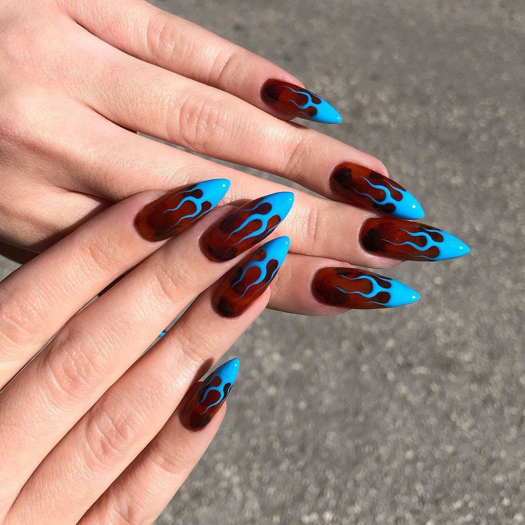 Artistic stiletto nails with extravagant flame pattern Stornfield