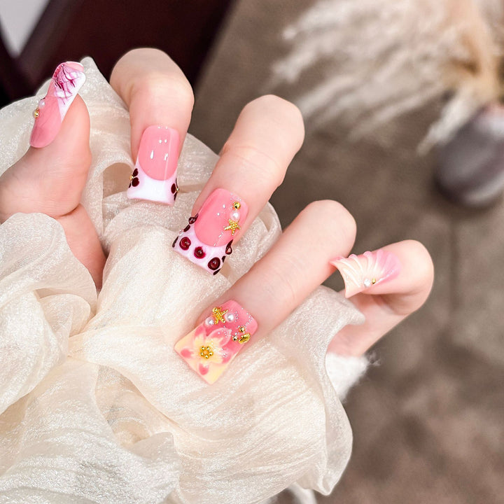 Artistic Acrylic Nail Design with Gem Accents