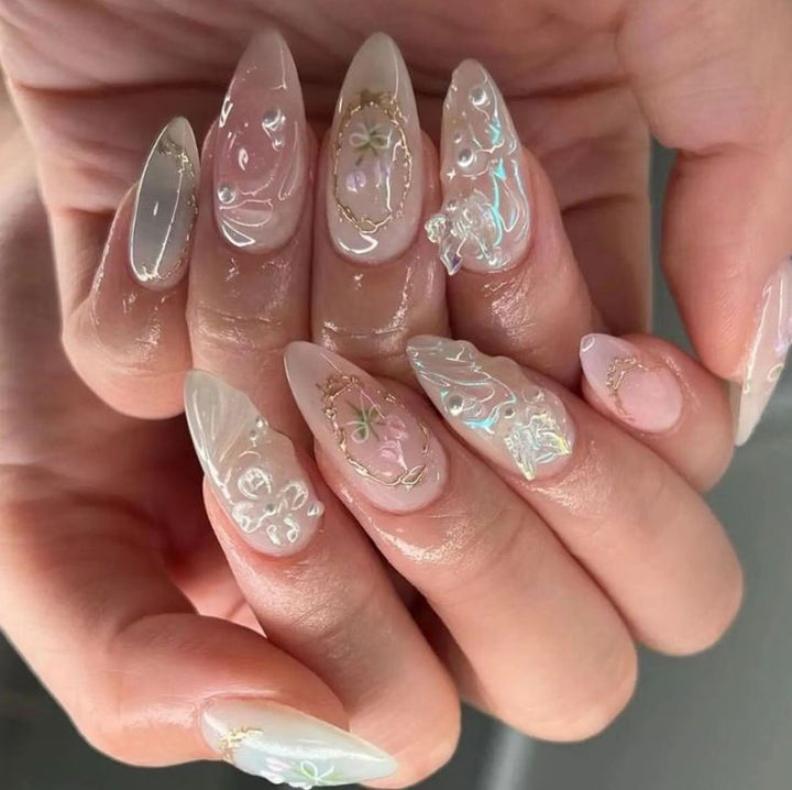 Elegant artificial nails with holographic and floral decorations Stornfield