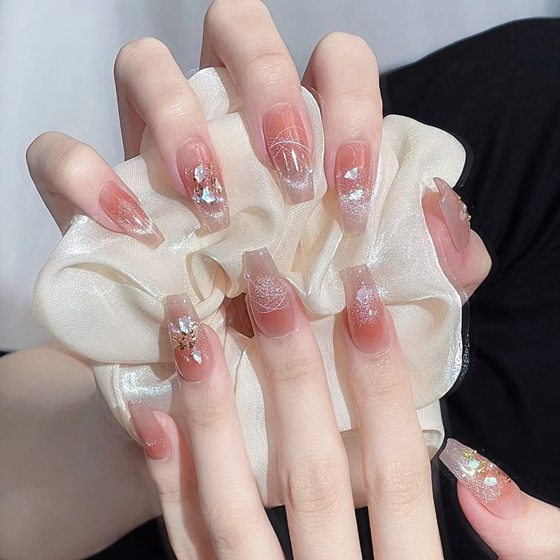 Nail art set with elegant wave patterns and delicate pearl accents Stornfield
