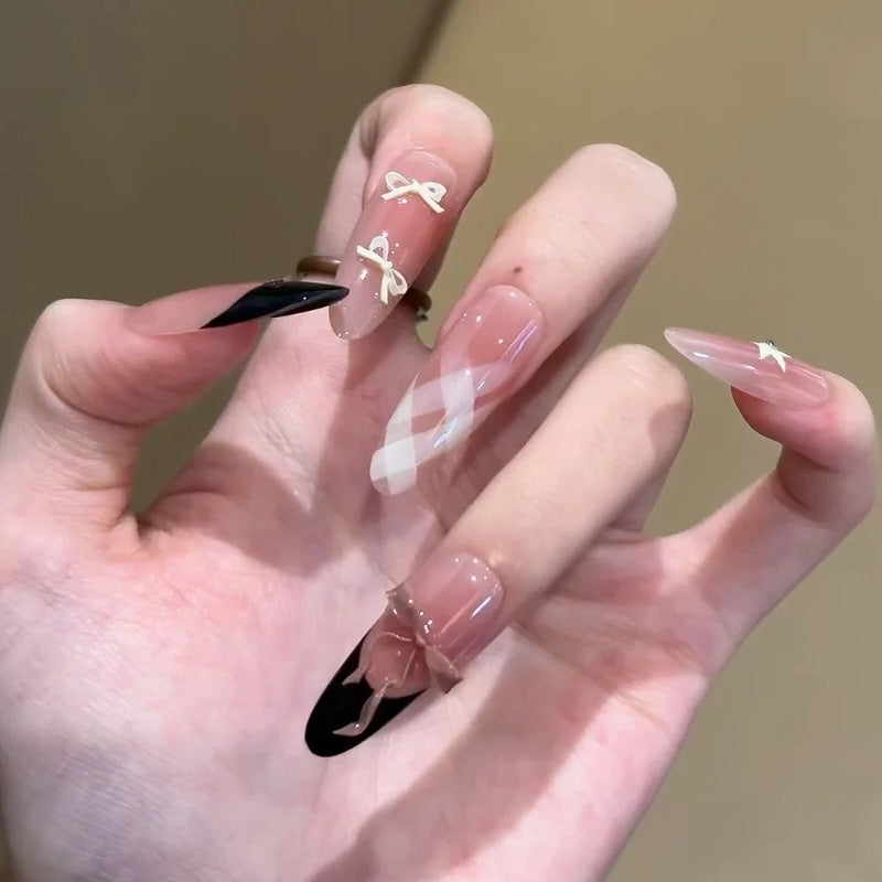 Glamorous artificial nails with creative embellishments Stornfield