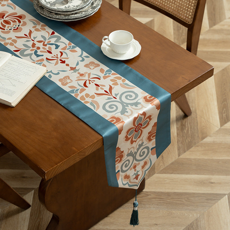 Decorative table runner with oriental tile pattern and tassels Stornfield