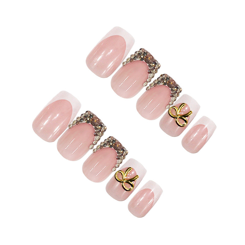 Artificial nail set with elegant gold embellishments Stornfield