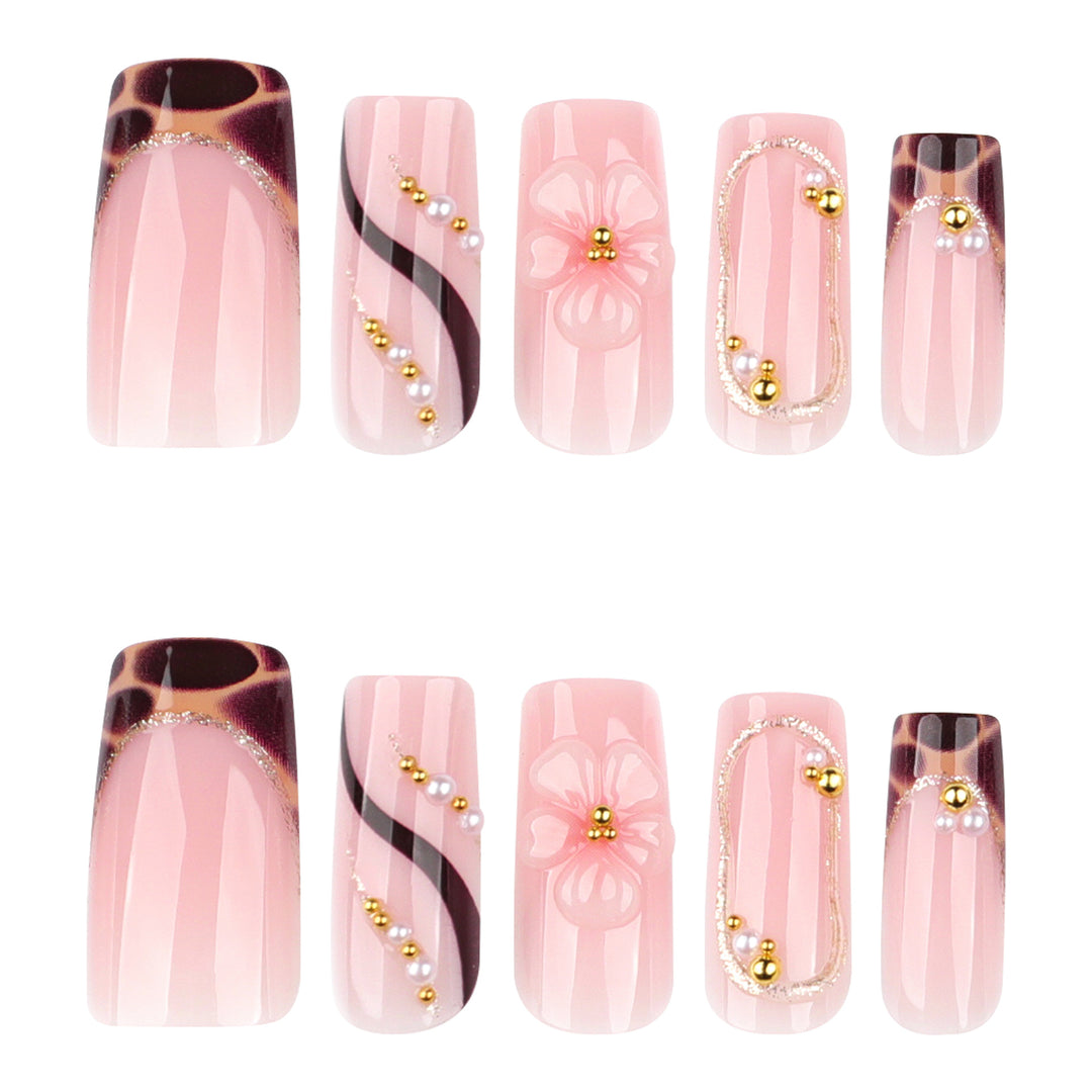 Artificial nail art with flower and glitter effects Stornfield