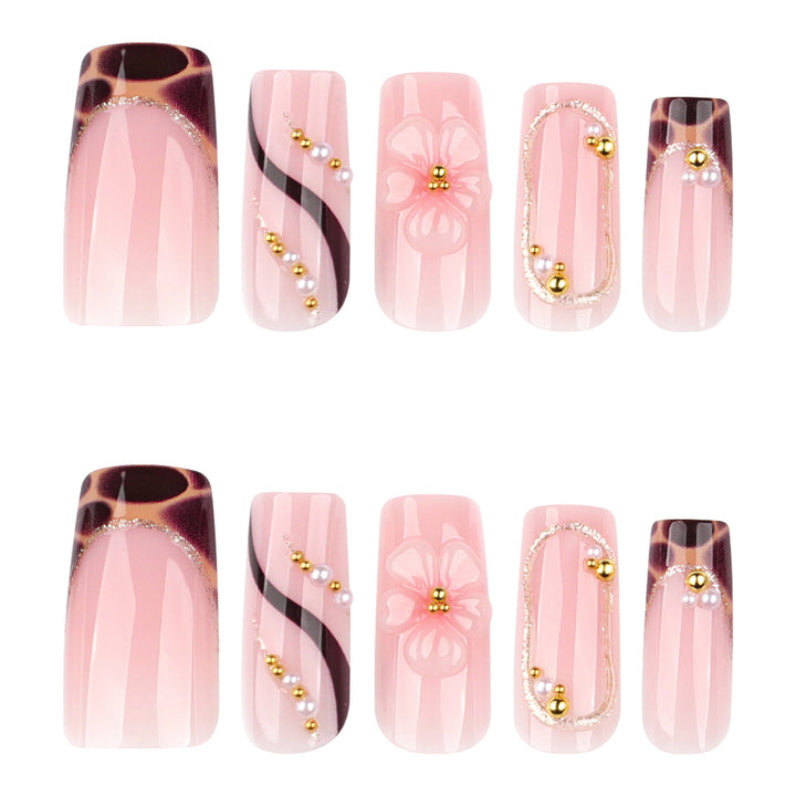Artificial nail art with flower and glitter effects Stornfield