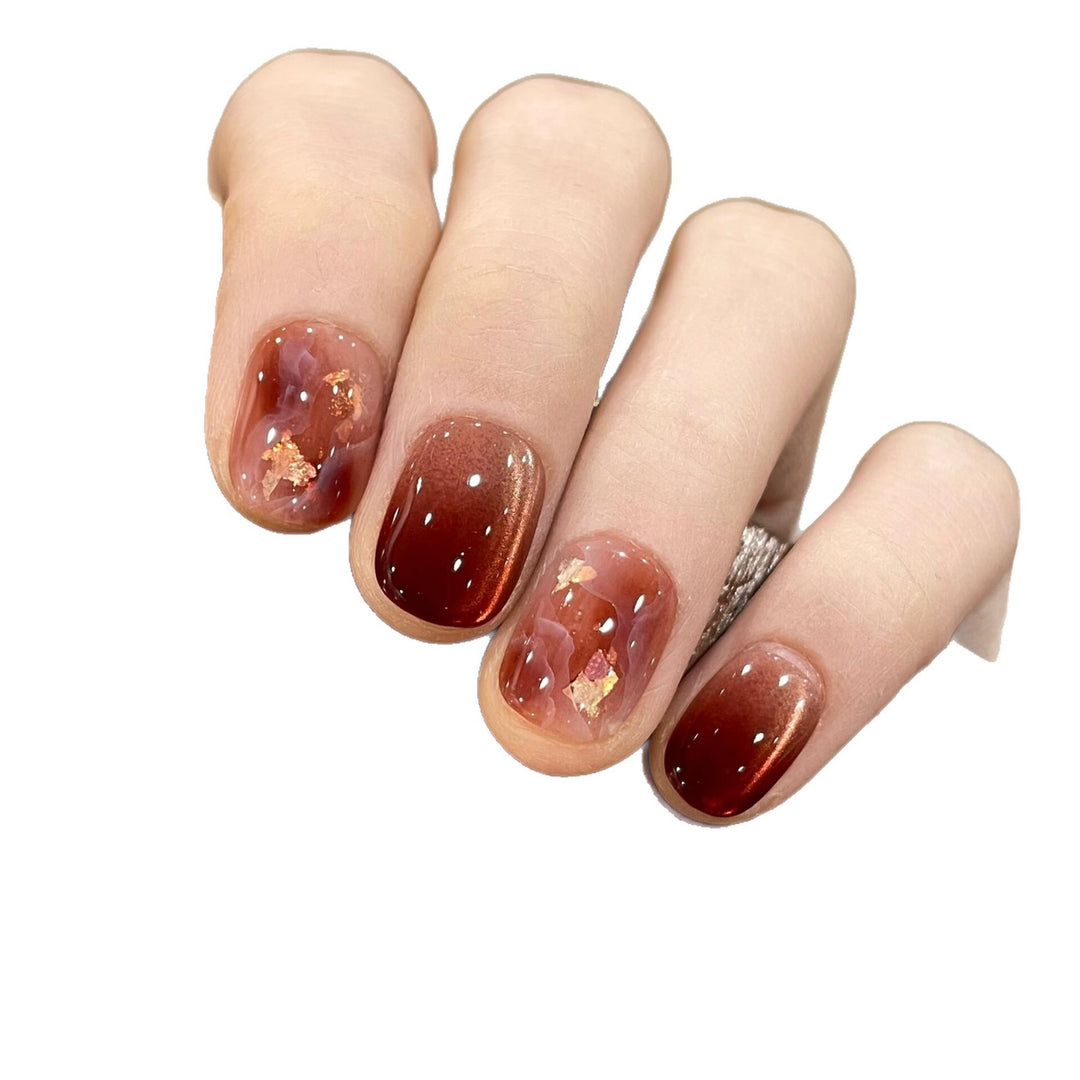 Artificial nails with elegant gradient and golden accents Stornfield