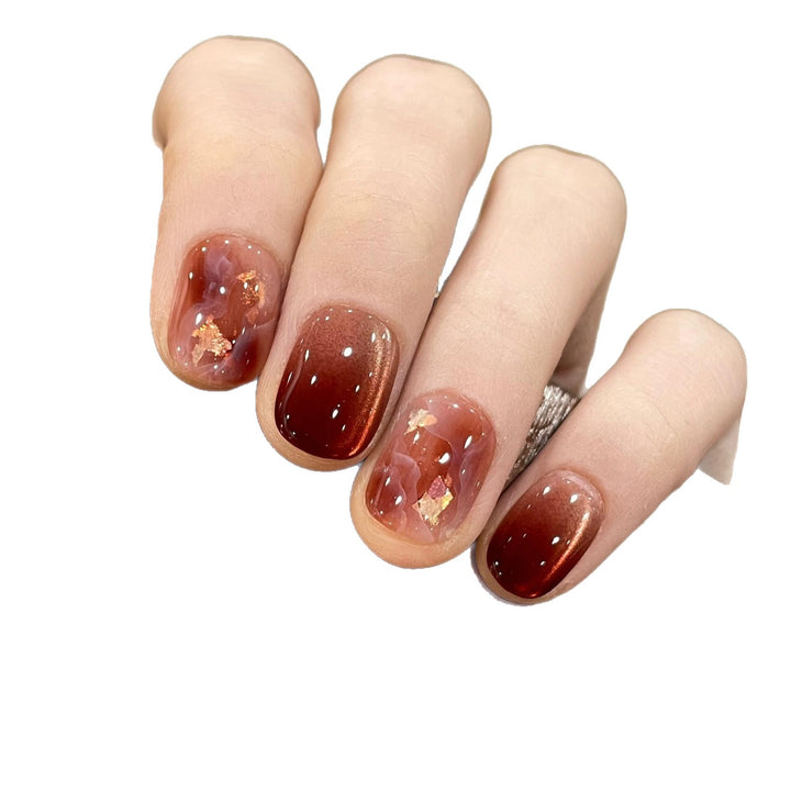 Artificial nails with elegant gradient and golden accents Stornfield