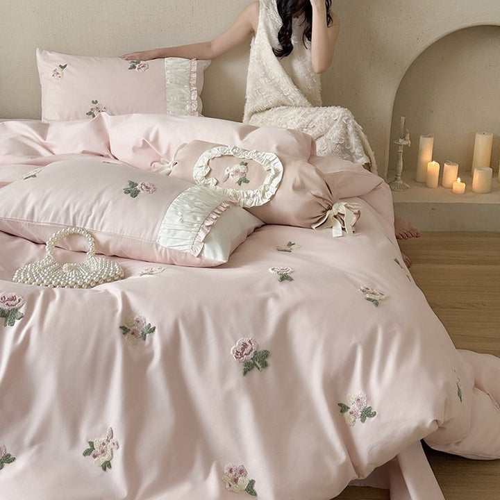 Luxurious cotton bedding set with delicate rose embroidery and ruffles