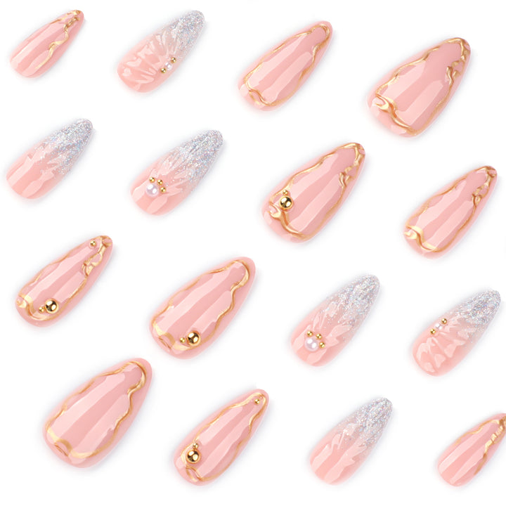 Artful stiletto nails with elegant gold embellishment design Stornfield