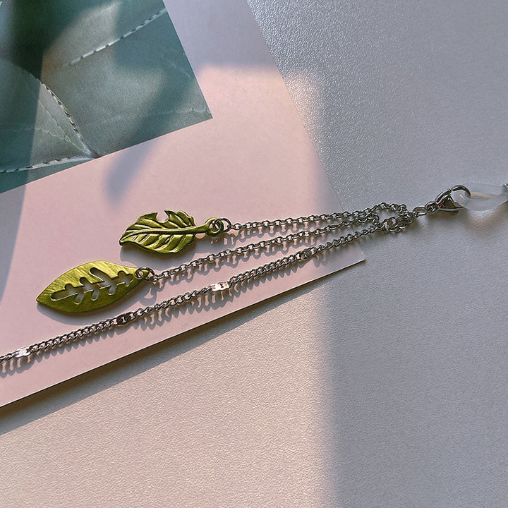 Fashionable glasses holder chain with leaf motifs Stornfield
