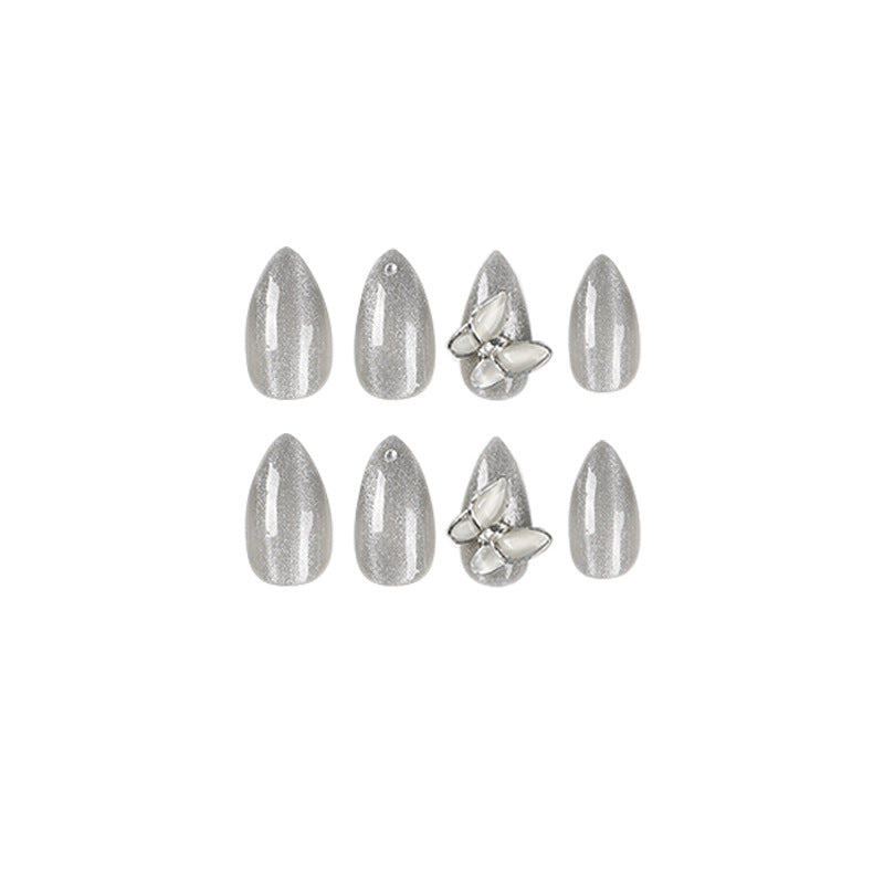 Glamorous stiletto nails with radiant glitter and elegant 3D design Stornfield