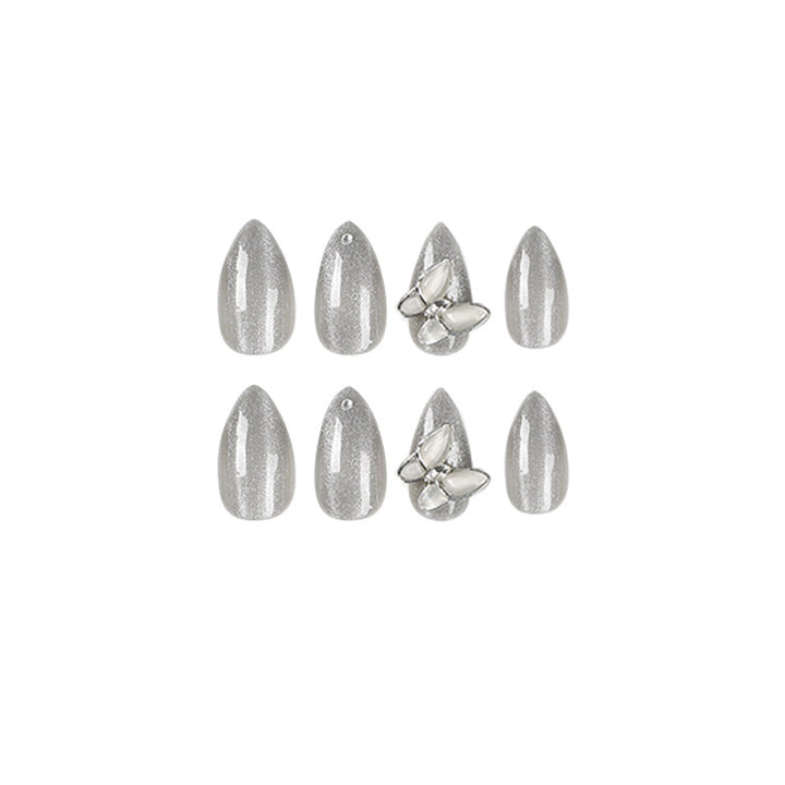 Glamorous stiletto nails with radiant glitter and elegant 3D design Stornfield