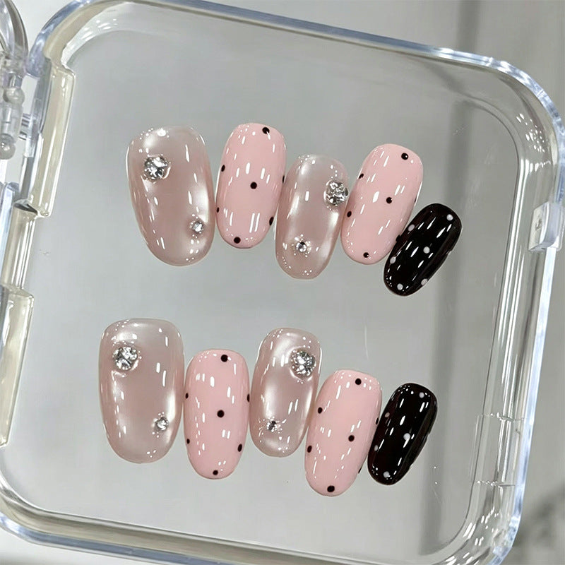 Acrylic nail set with glamorous rhinestone accents and modern dots Stornfield
