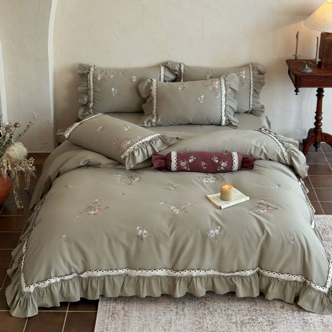 Romantic bedding set with ruffle, floral embroidery and decorative roll
