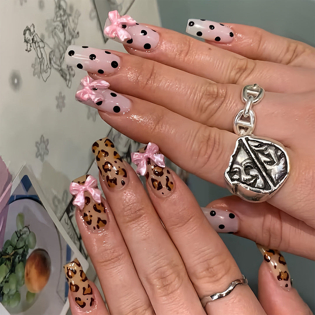 Creative artificial nails with bows and dots Stornfield