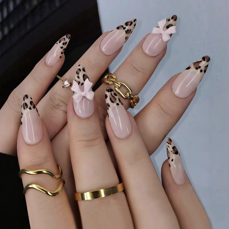 Acrylic nail set with leopard pattern and decorative bows Stornfield