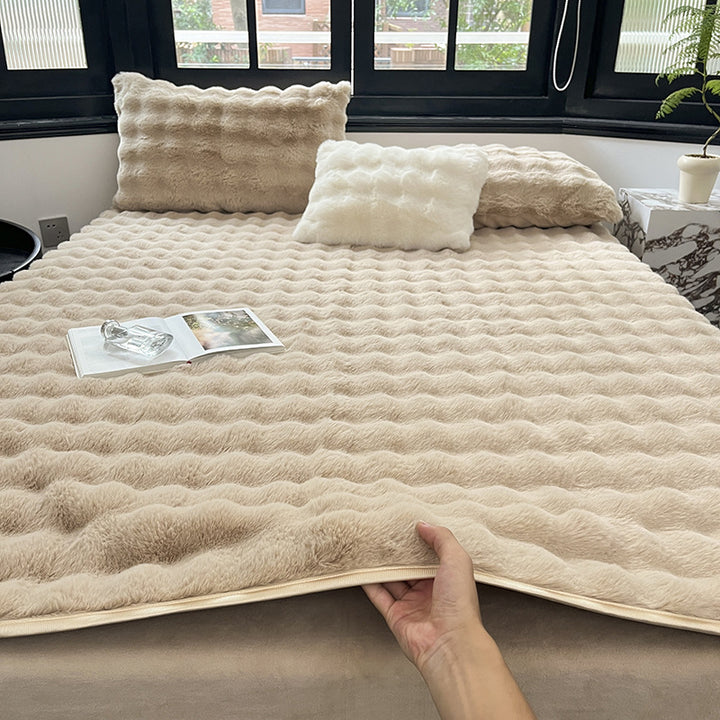 Padded microfiber mattress topper with wave stitching and plush surface