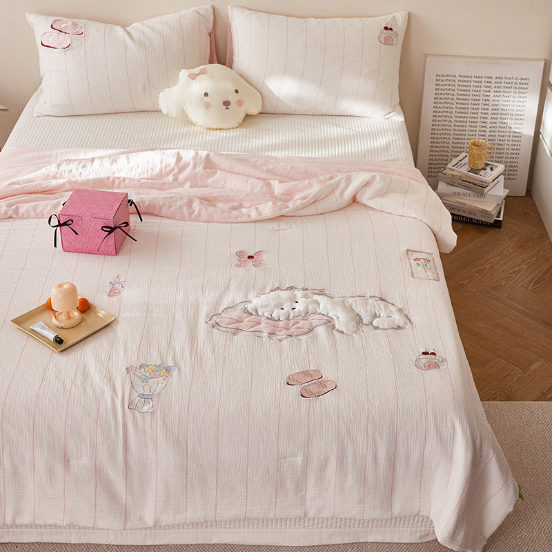Quilted bedding and throw set with appliquéd plush puppy made of cotton muslin