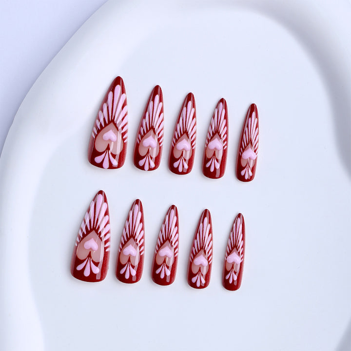 Artificial nails with playful heart design and elegant accents Stornfield