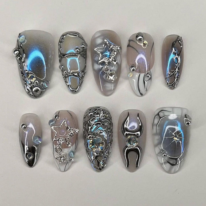Artful Nail Extensions with Shiny Metal Accents Stornfield
