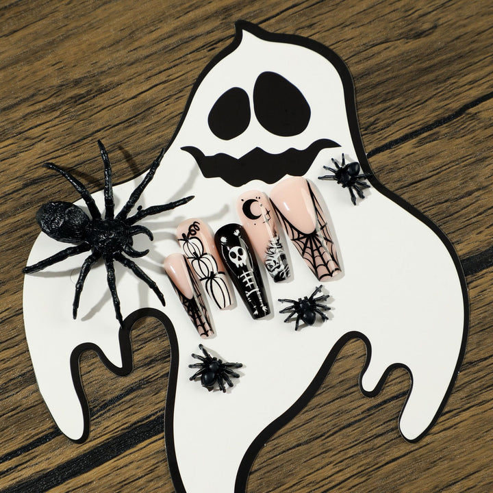 Artificial nail art in Halloween style with graffiti designs Stornfield