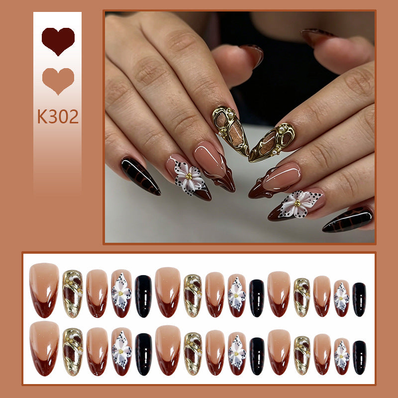 Artificial nail set with extravagant 3D design and elegant embellishments Stornfield