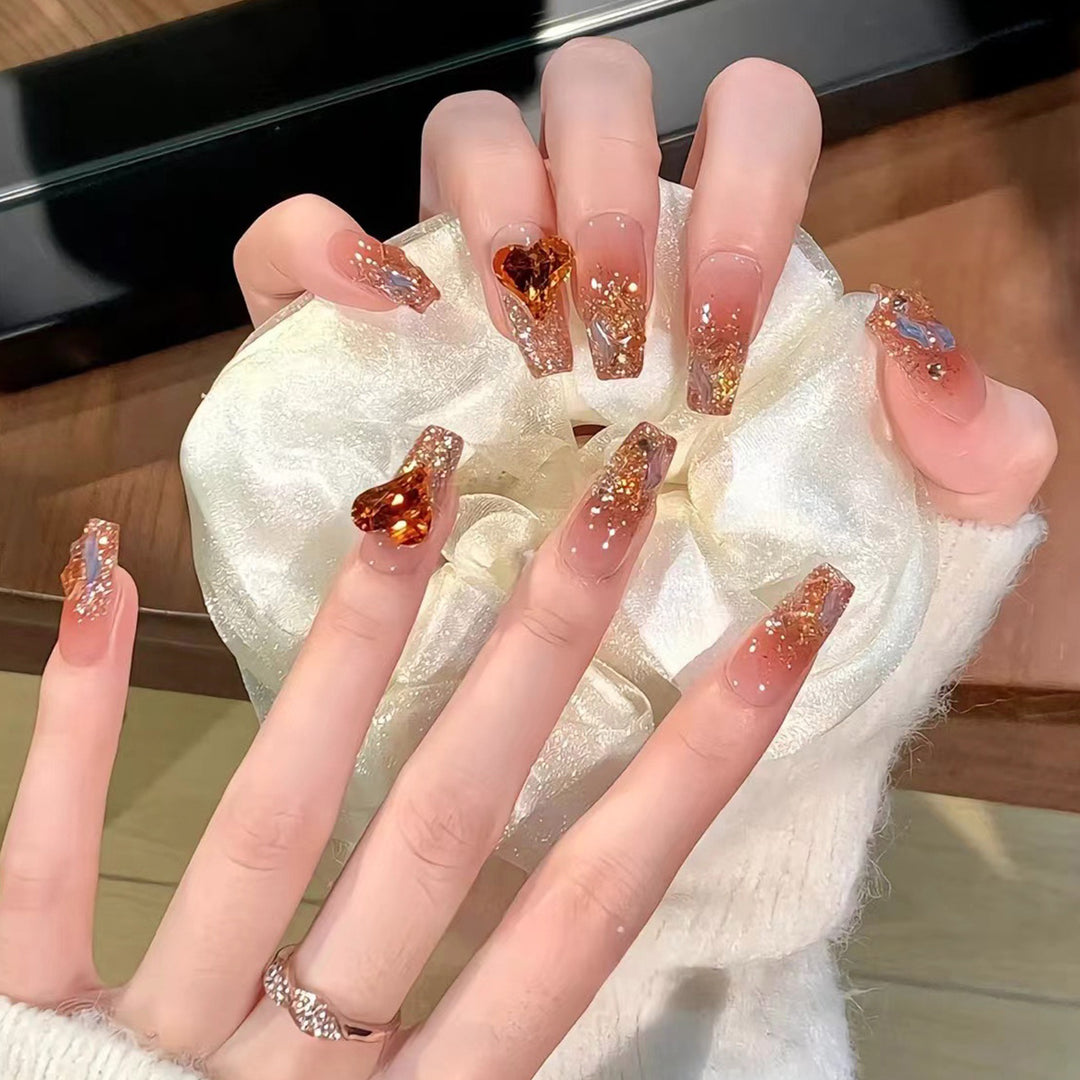 Artistic acrylic nails with heart design and sparkling accents Stornfield