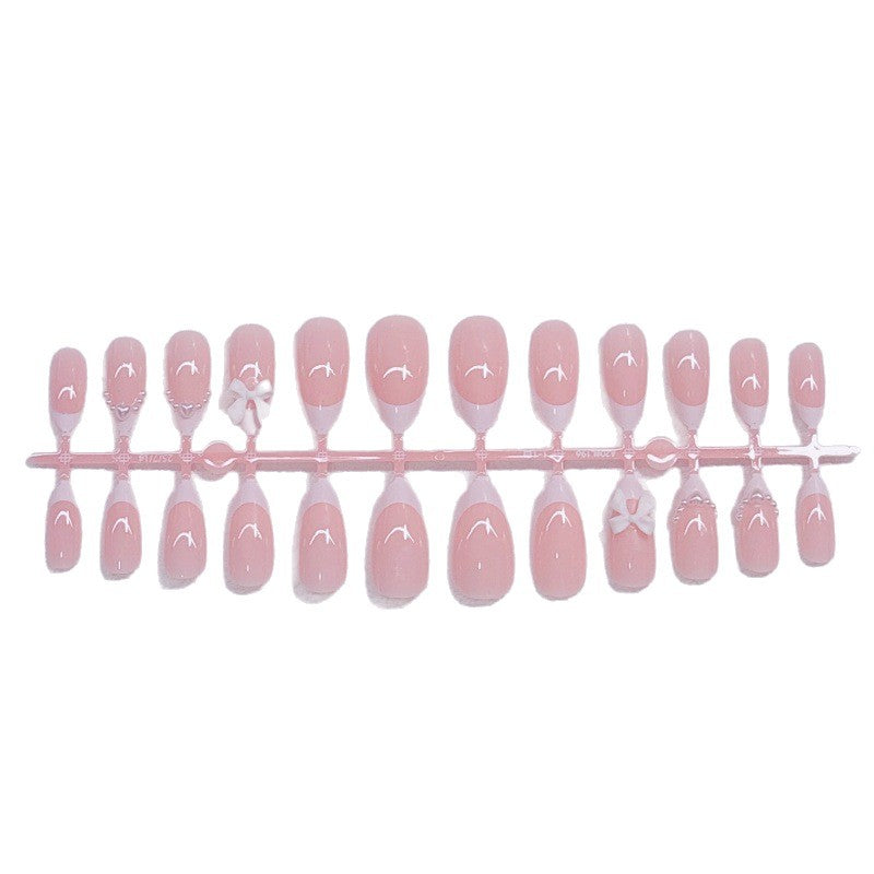 Elegant artificial nails with curved tips and decorative bows Stornfield