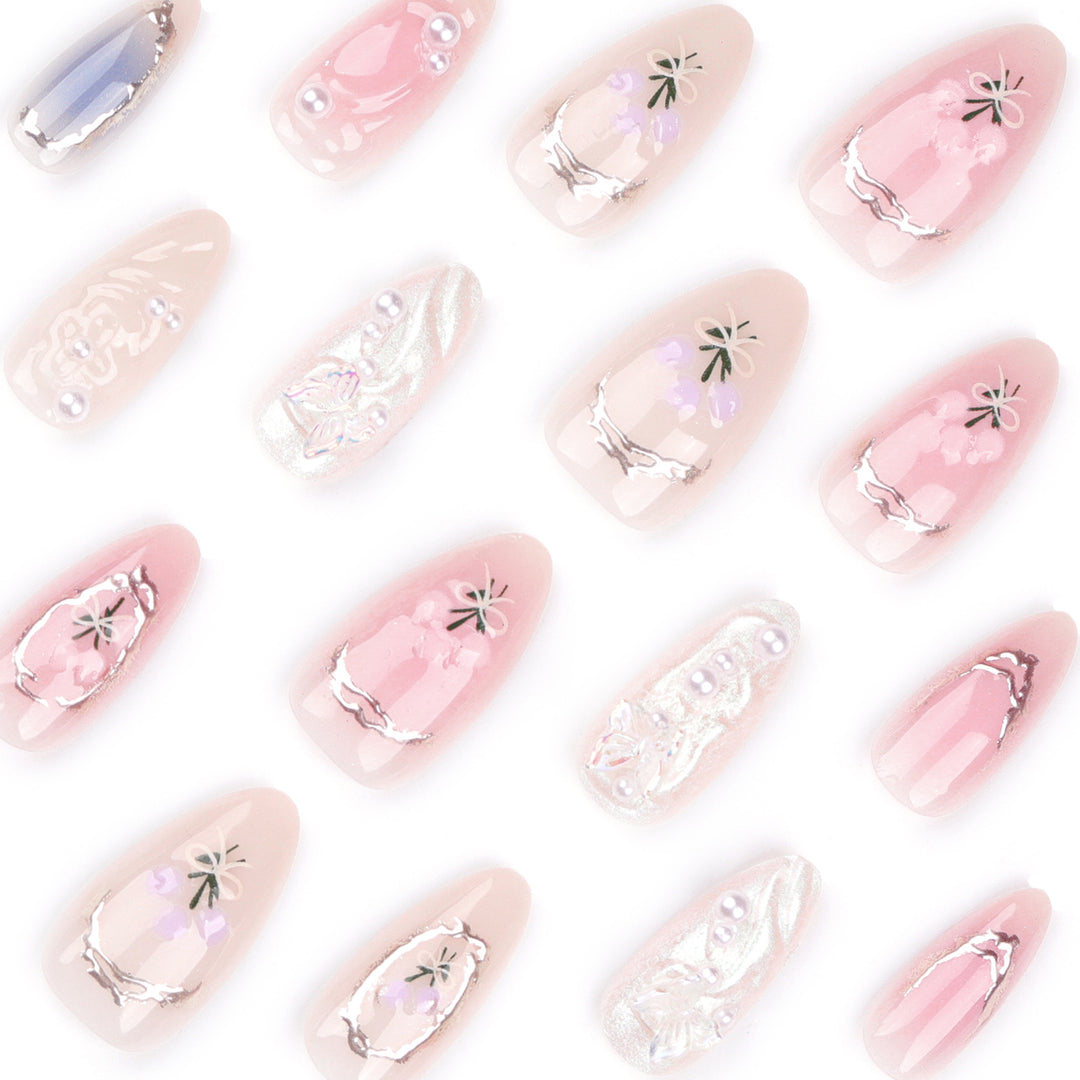 Artful nail extensions with elegant flower decoration Stornfield