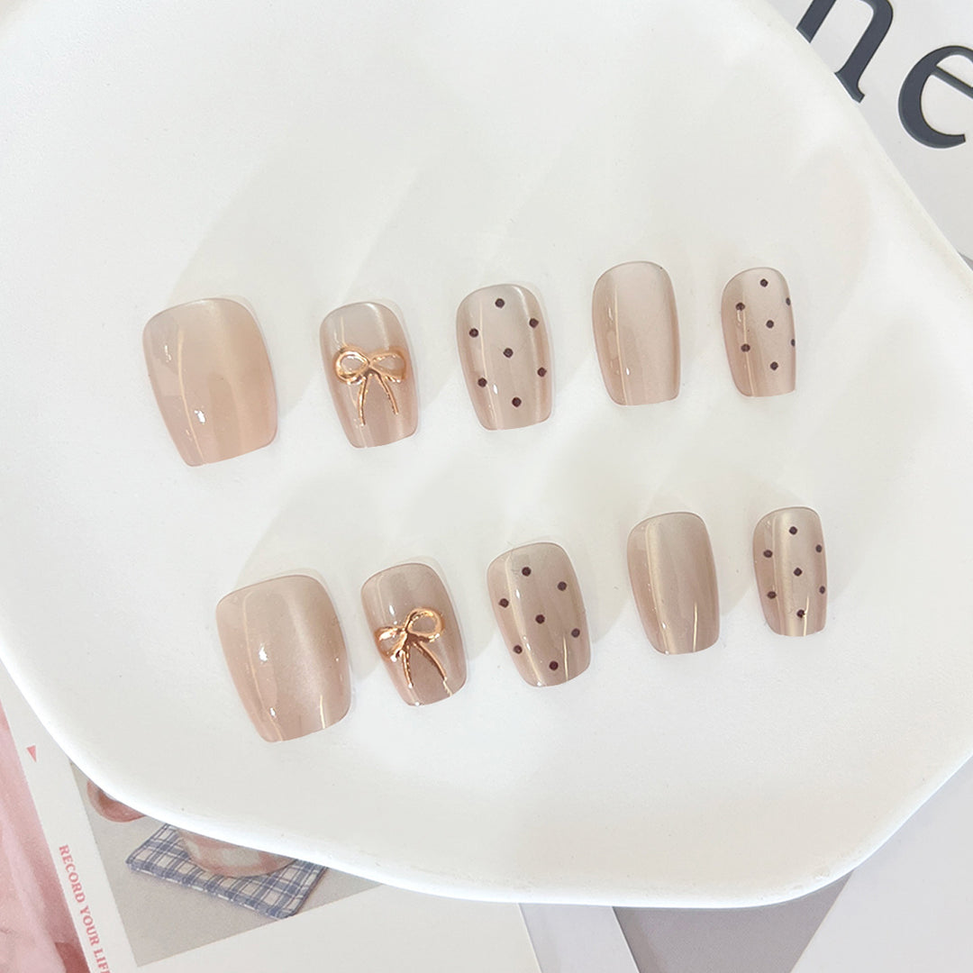 Artificial nail tips with elegant bow designs Stornfield