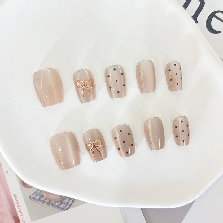 Artificial nail tips with elegant bow designs Stornfield