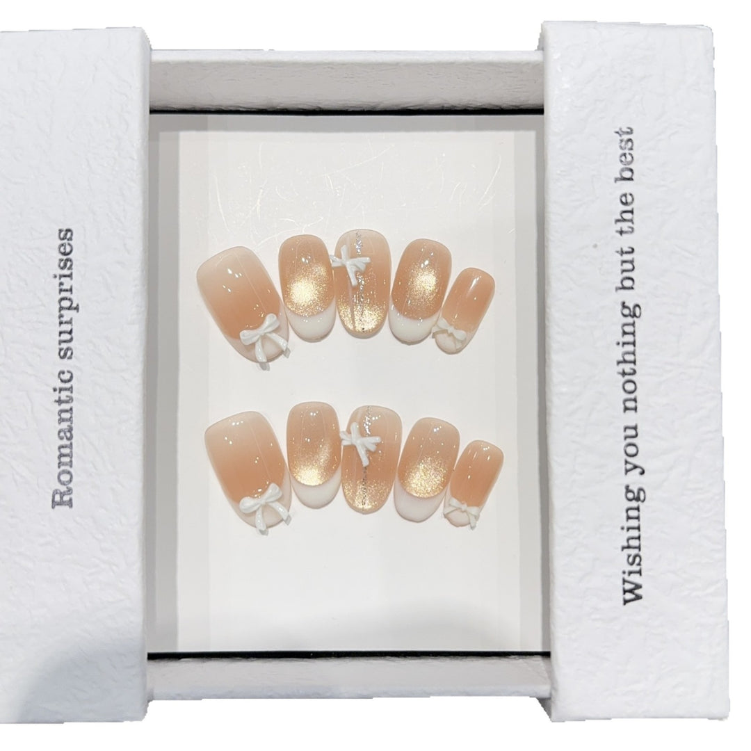 Artificial nails with romantic bow and glitter effects Stornfield